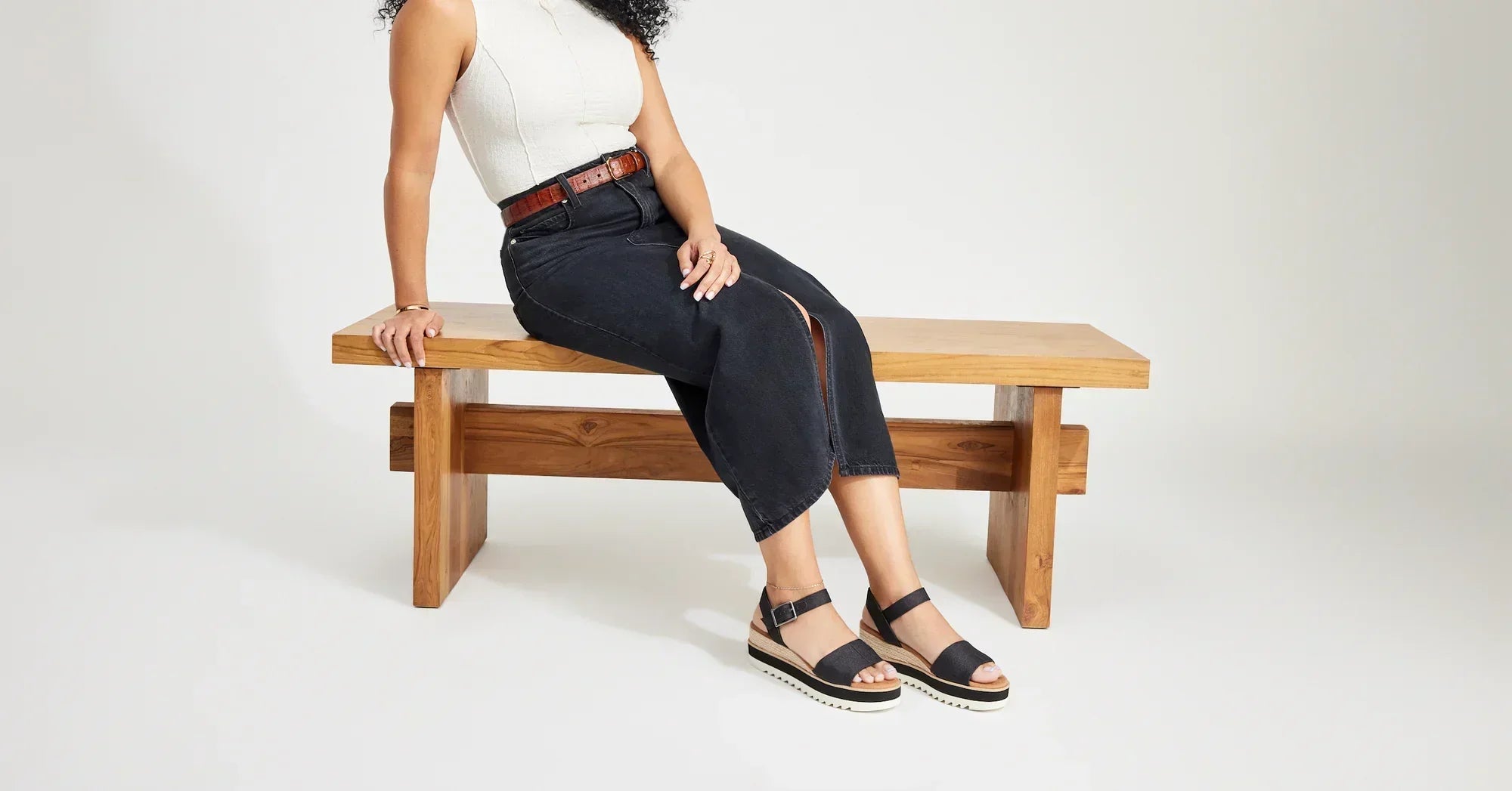 Model wearing Brynn Platform Sandal in leather black shown.