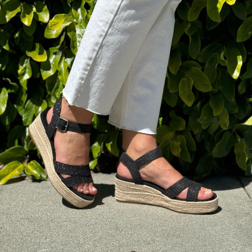 TOMS Audrey black metallic wedge sandal on model up close detail shot