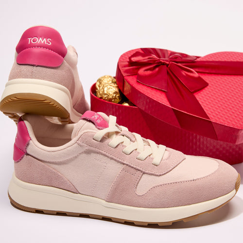 Laydown image of the pink TRVL Lite retro lace up sneaker