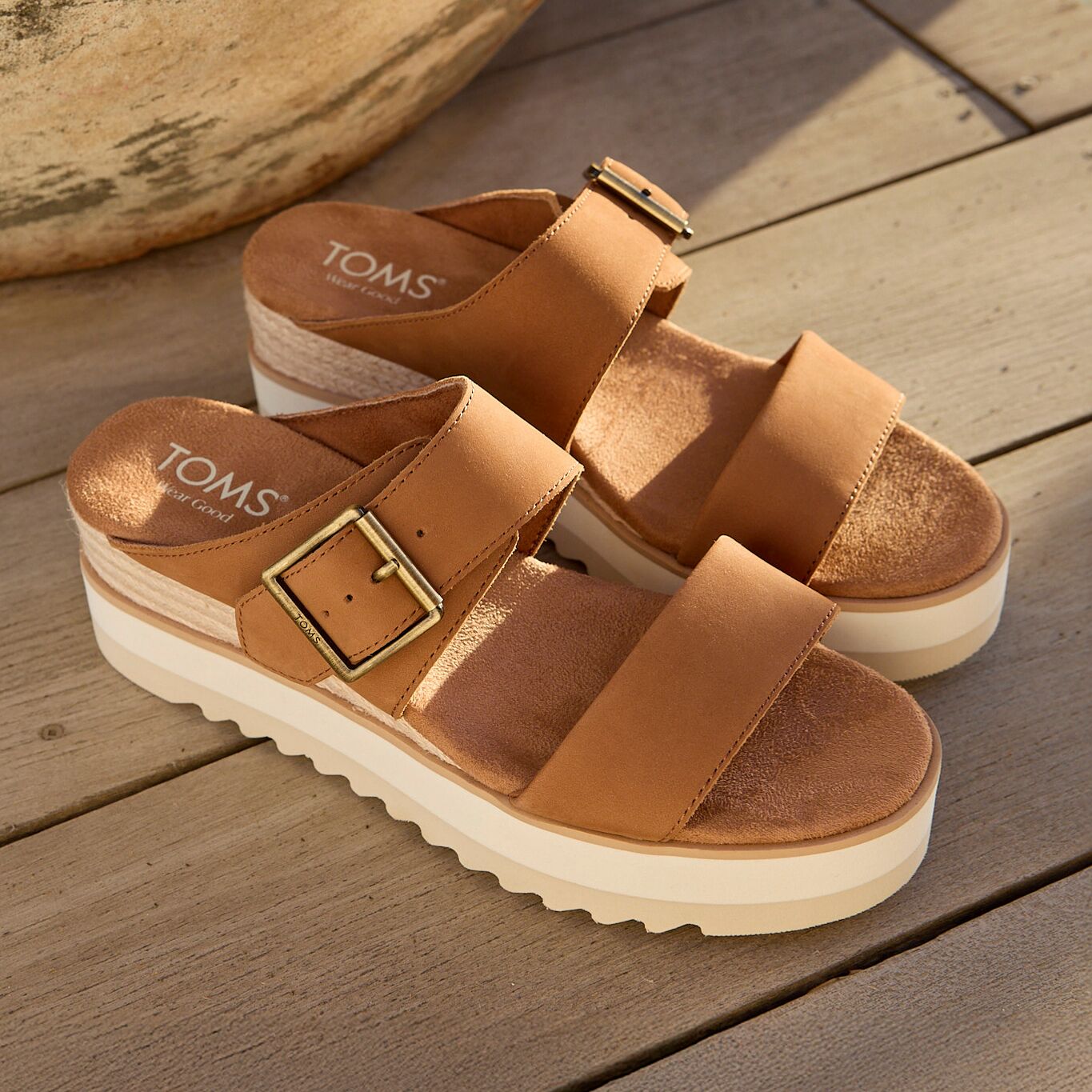 Laydown image of the brown sugar leather Diana Buckle wedge sandal