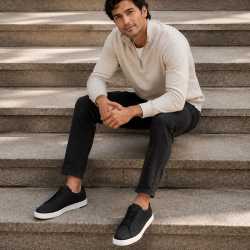 On model image of the black leather TRVL Lite Miles lace up sneaker