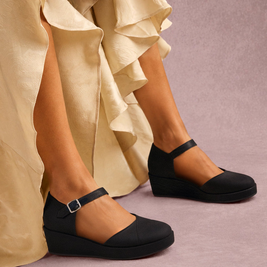 On model image of the black canvas Gwyneth wedge