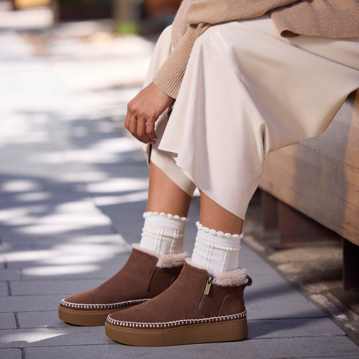 On model image of the Womens Percy Mid Platform Sneaker Water Resistant Hot Cocoa Suede w/ Faux Fur