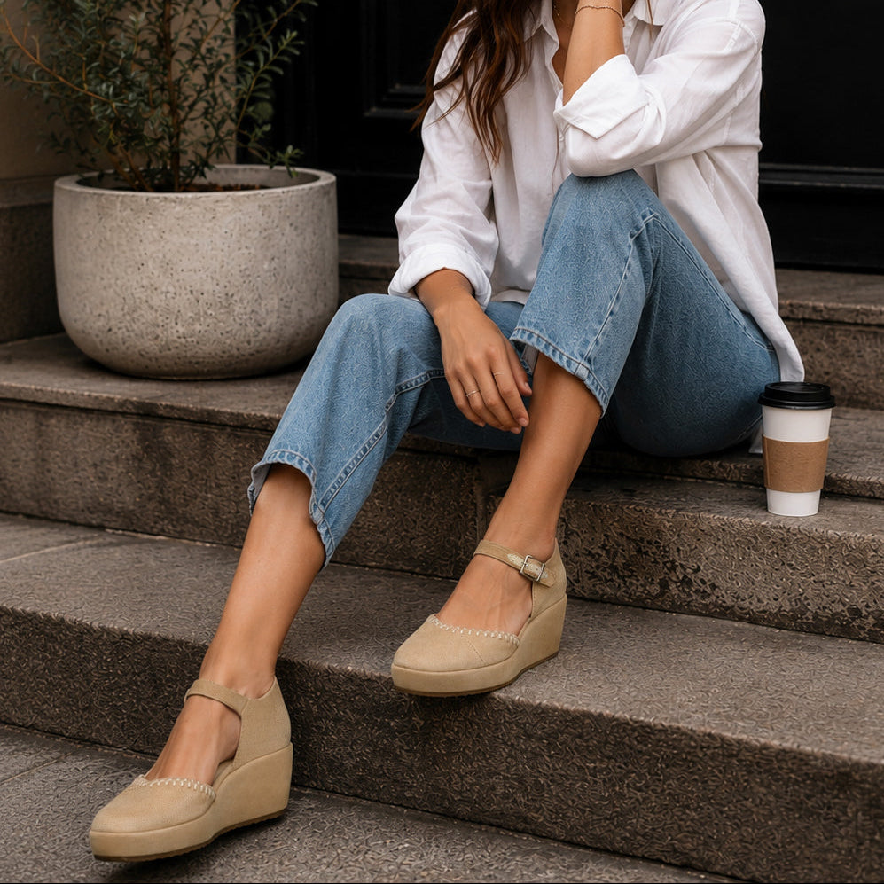On model image of the taupe suede deco stitch Gwyneth wedge