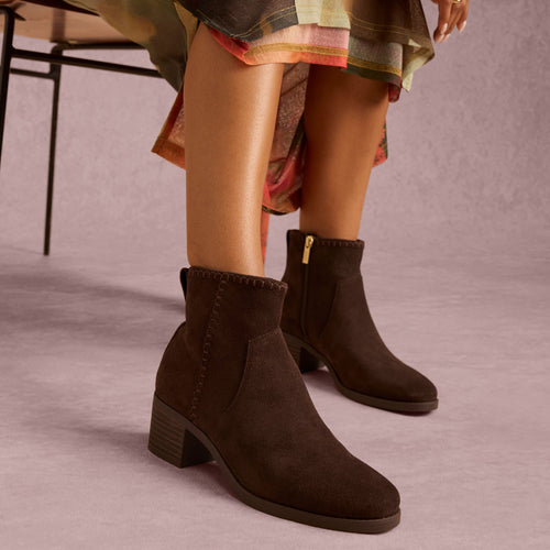 On model image of the Womens Delilah Heeled Boot Water Repellent Chocolate Brown Suede