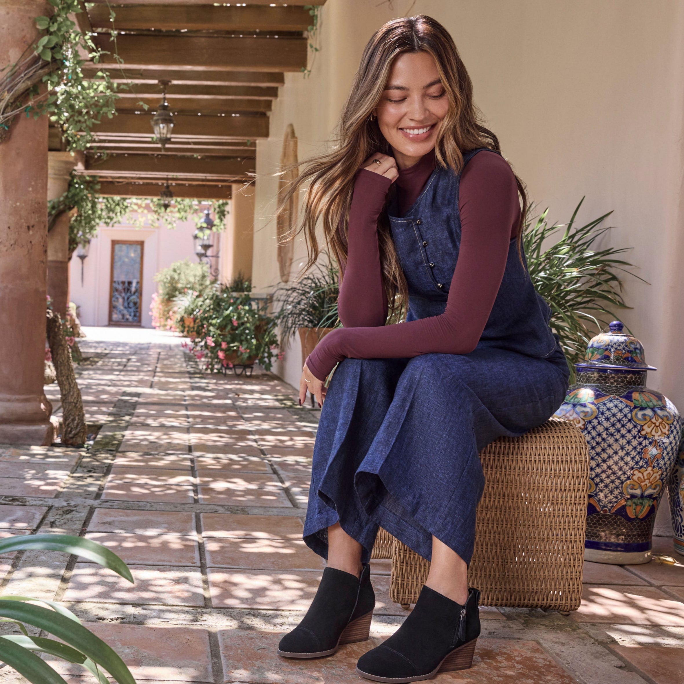 On figure image of the black suede Goldie bootie