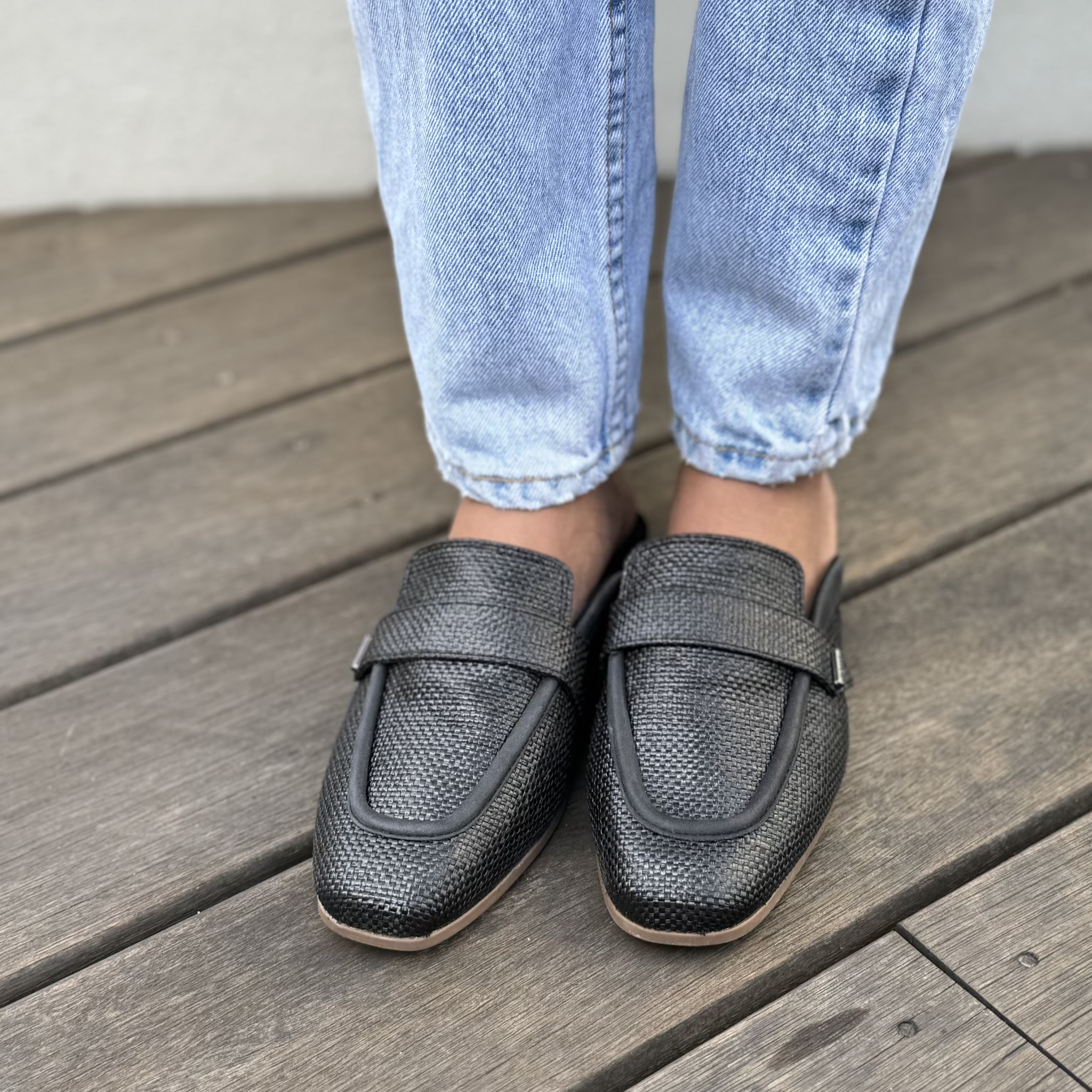 lynette black raffia leather in black on model up close detail shot
