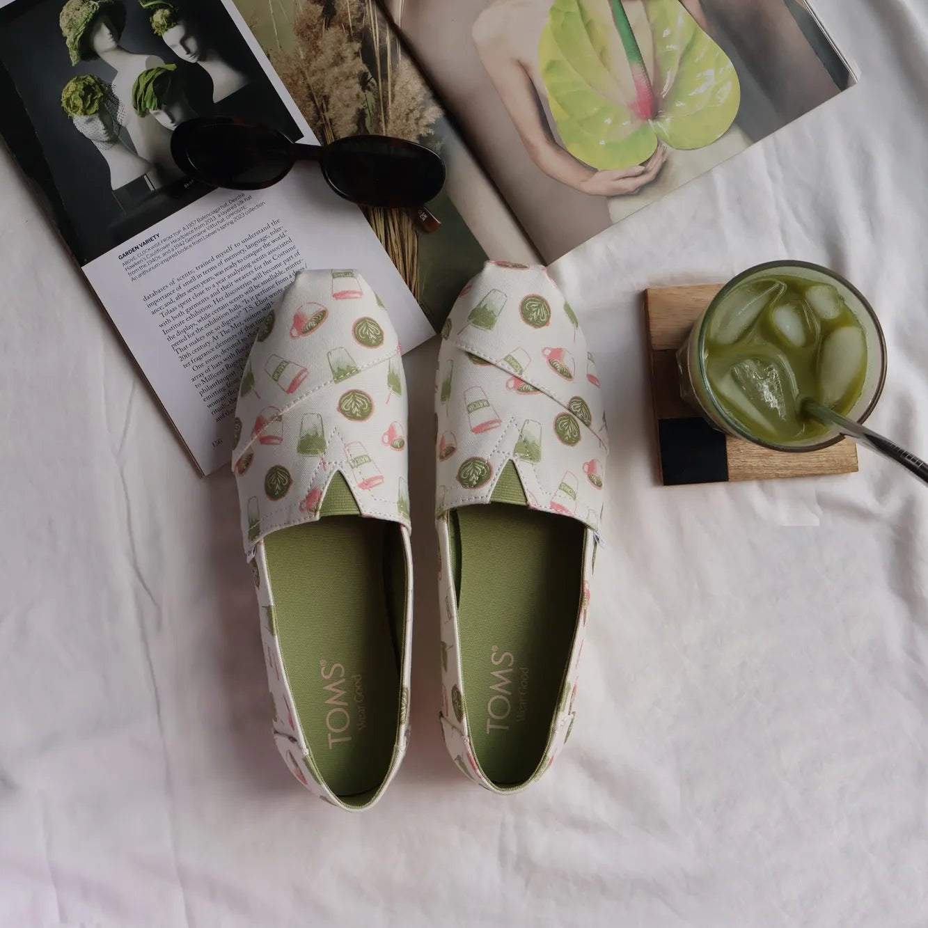 Limited edition Matcha Alpargata styled with matcha drink, magazine and sunglasses
