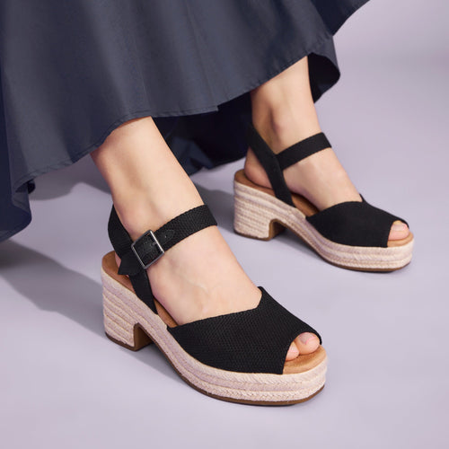 Isla peep toe platform sandal in black with rope wrap sole on model up close detail shot