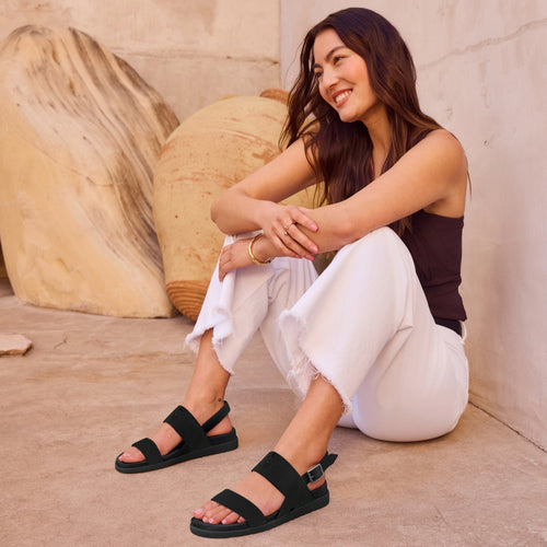 On figure image of the black Marin sandals