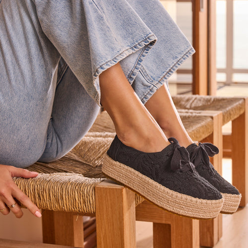 On model image of the black crochet Valencia lace up espadrille