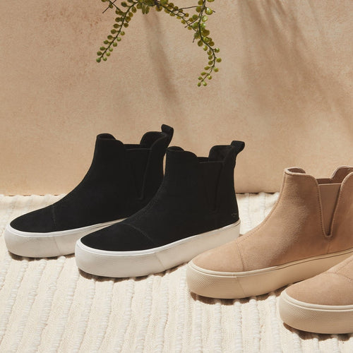 Laydown image of the black suede Fenix Platform slip on sneaker