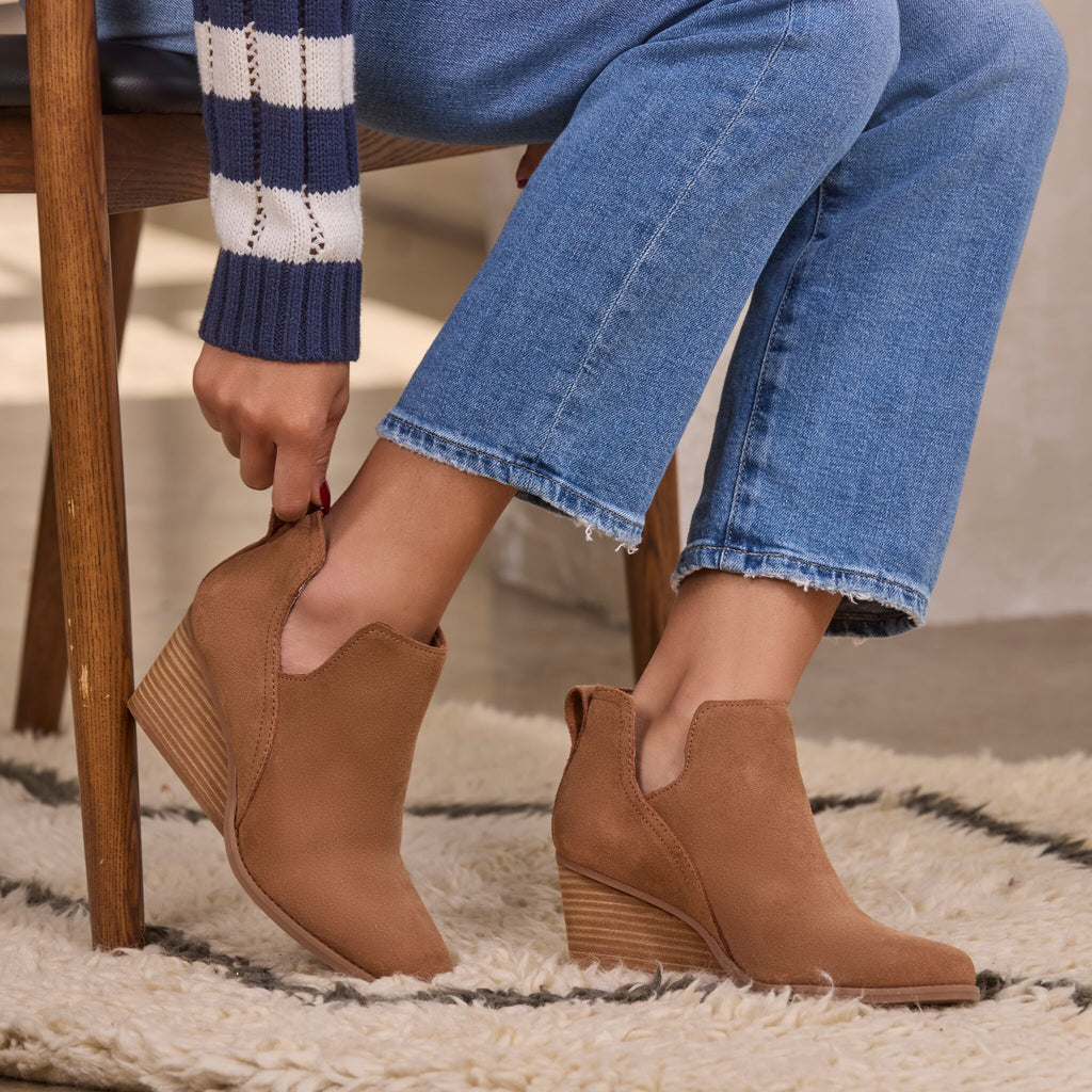 On model shot of the tan suede Gwen wedge bootie