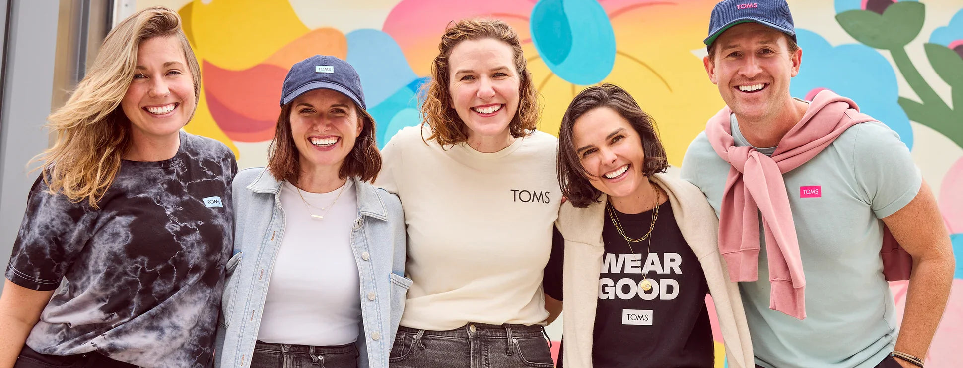 A group of TOMS employees shown.