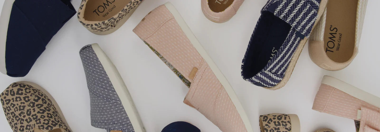 Various TOMS footwear shown.
