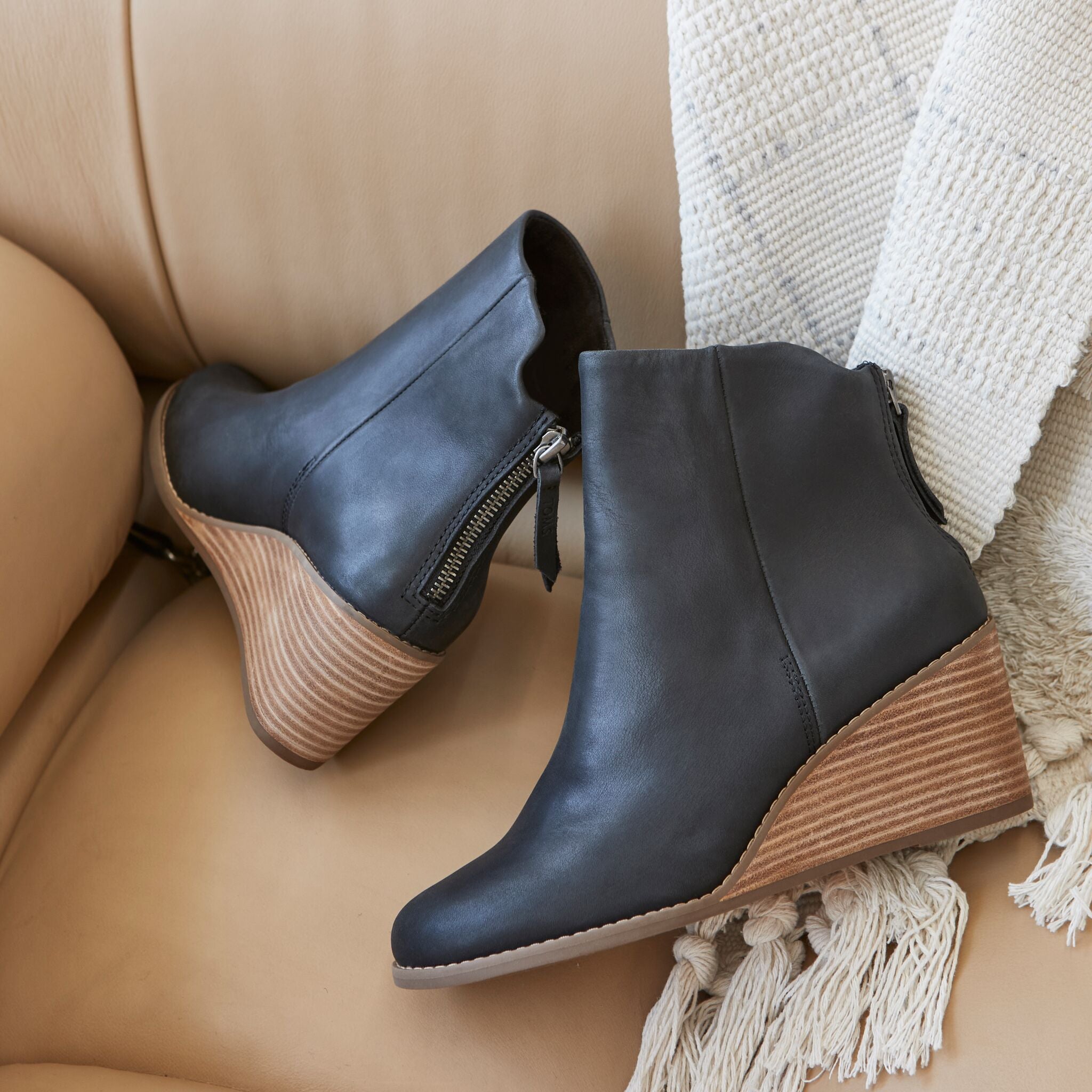 Laydown image of the black leather Casey wedge boot