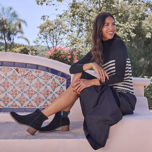 On figure image of the black suede Delilah Women's heeled boot