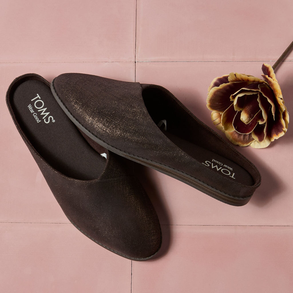 Laydown image of the shimmer chocolate brown Amelia slip on mule
