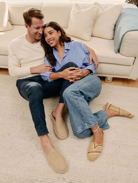 Hannah & husband sitting together, wearing Oat Engineered Mesh Santiago Mule & Almond Multi Engineered Crochet Alpargata.