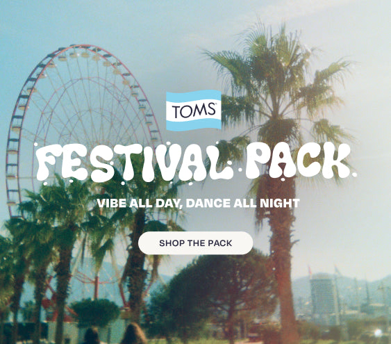 TOMS logo. FESTIVAL PACK. VIBE ALL DAY, DANCE ALL NIGHT. Shop the Pack. Festival scene background. Diana Wedge Sandal on model.