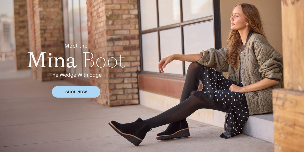 Meet the Mina Boot. The Wedge With Edge. SHOP NOW: Water Repellent Black Suede shown on model.
