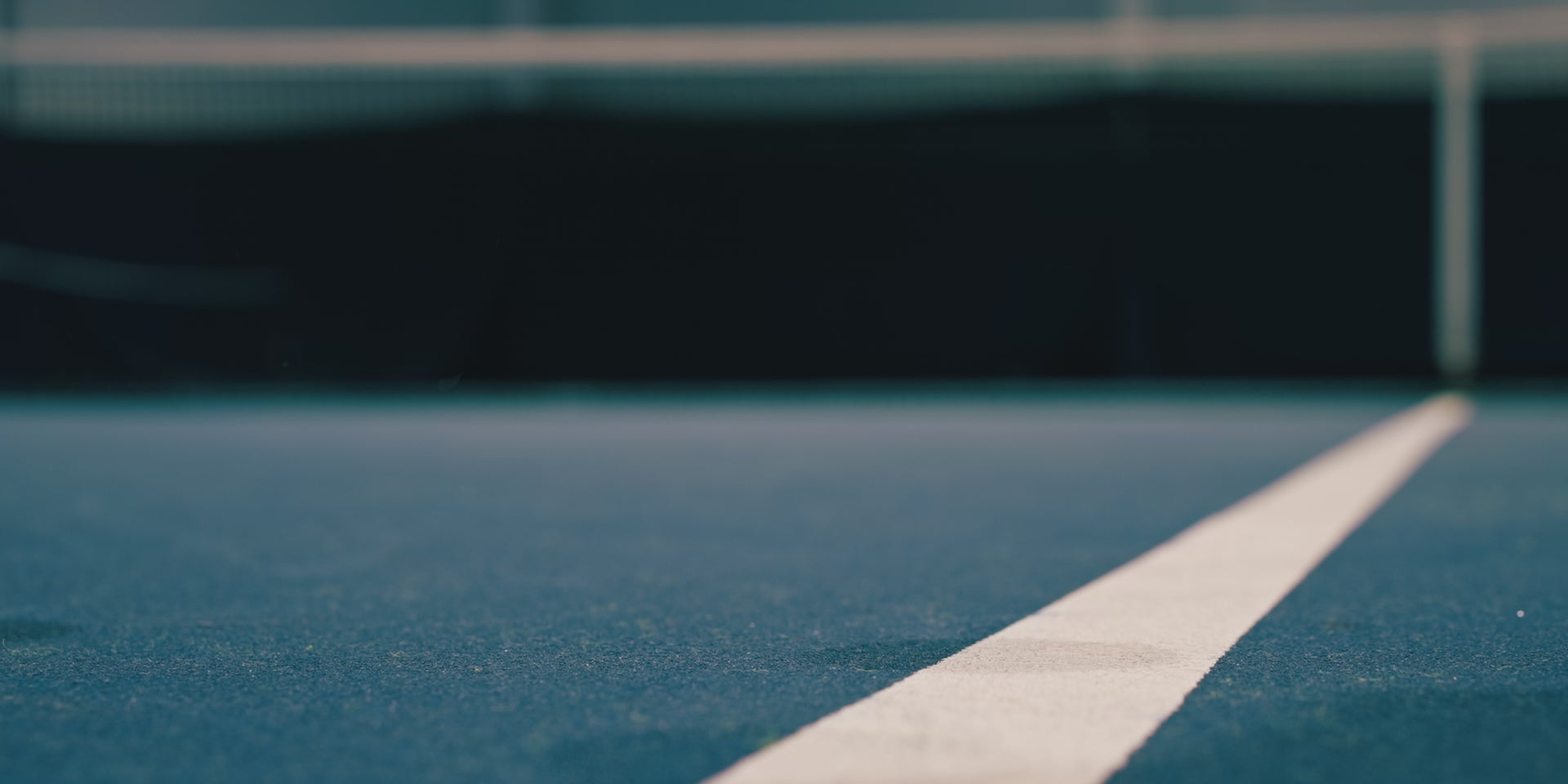 Tennis ball bouncing on court.