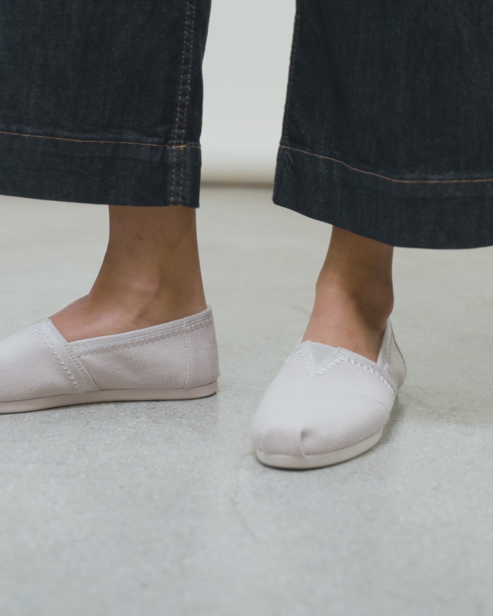 Alpargata on model, styled with dark cropped denim in soft grey embroidery