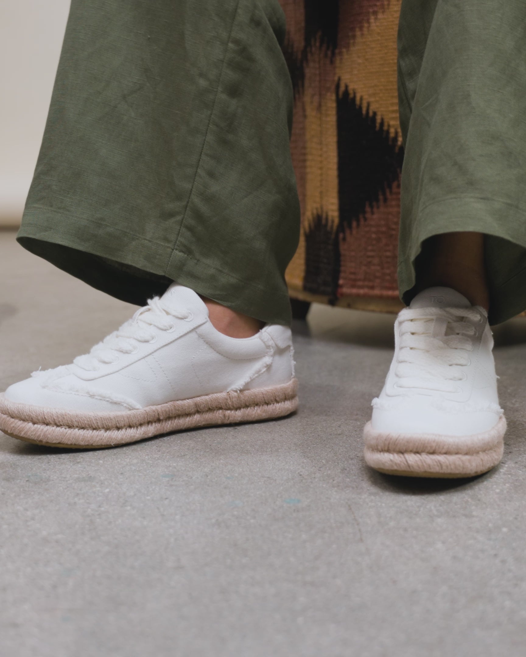 Jesse espadrille sneaker on model, shown how to style with green linen pants