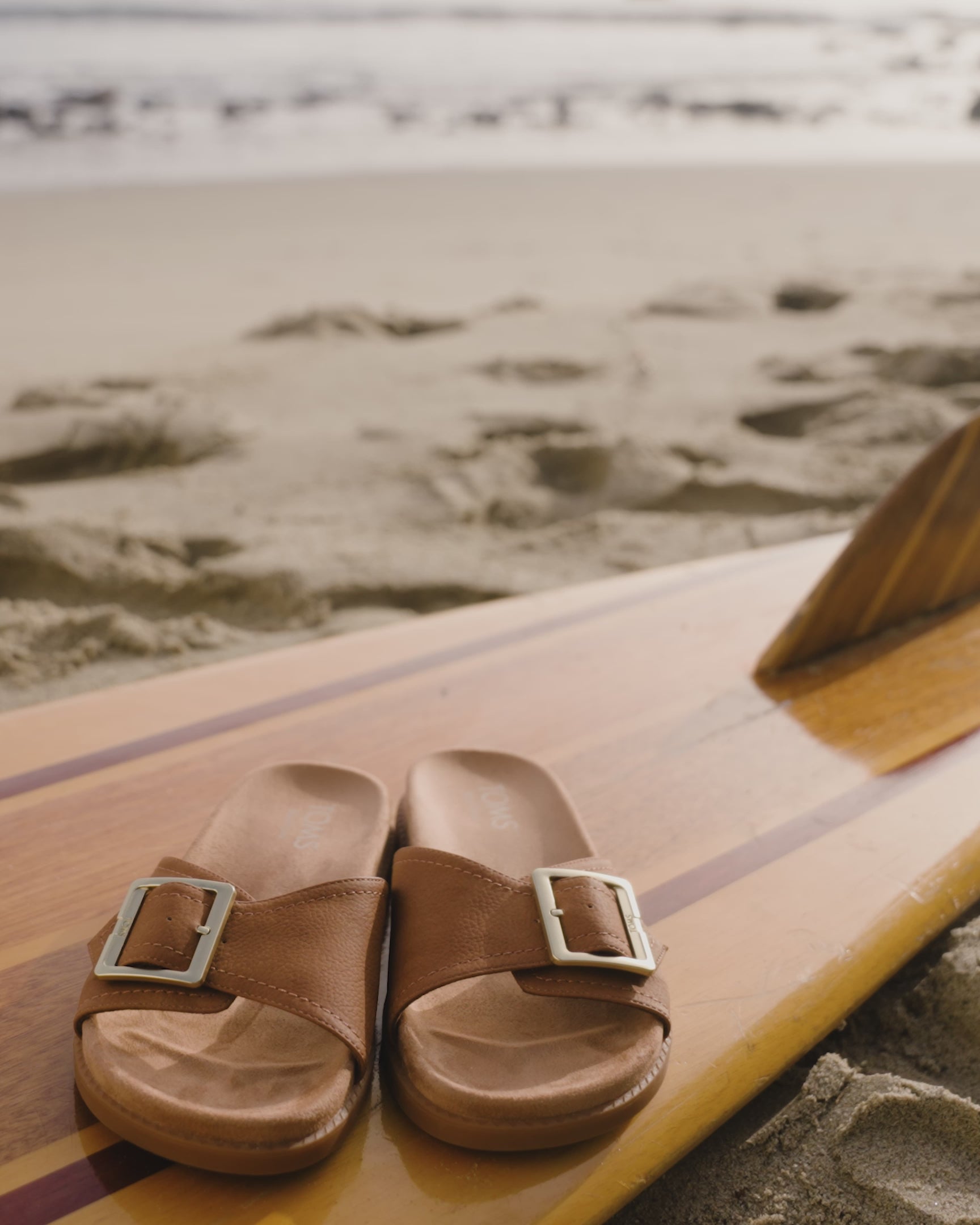 Marin slide sandal in brown sugar nubuck up close detail shots styled at the beach