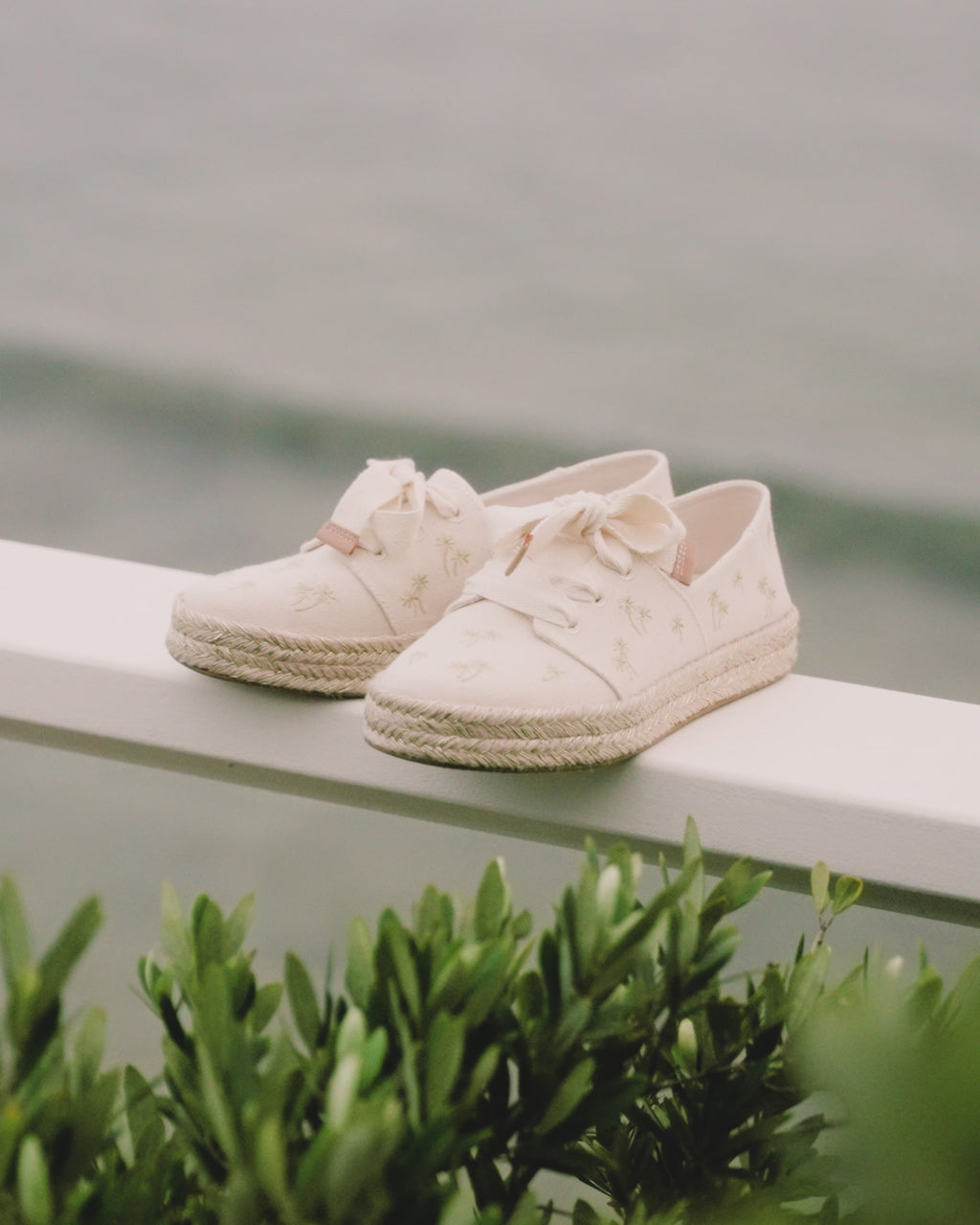 carolina lace up espadrille with embroidered palm trees up close, detail shot of shoes