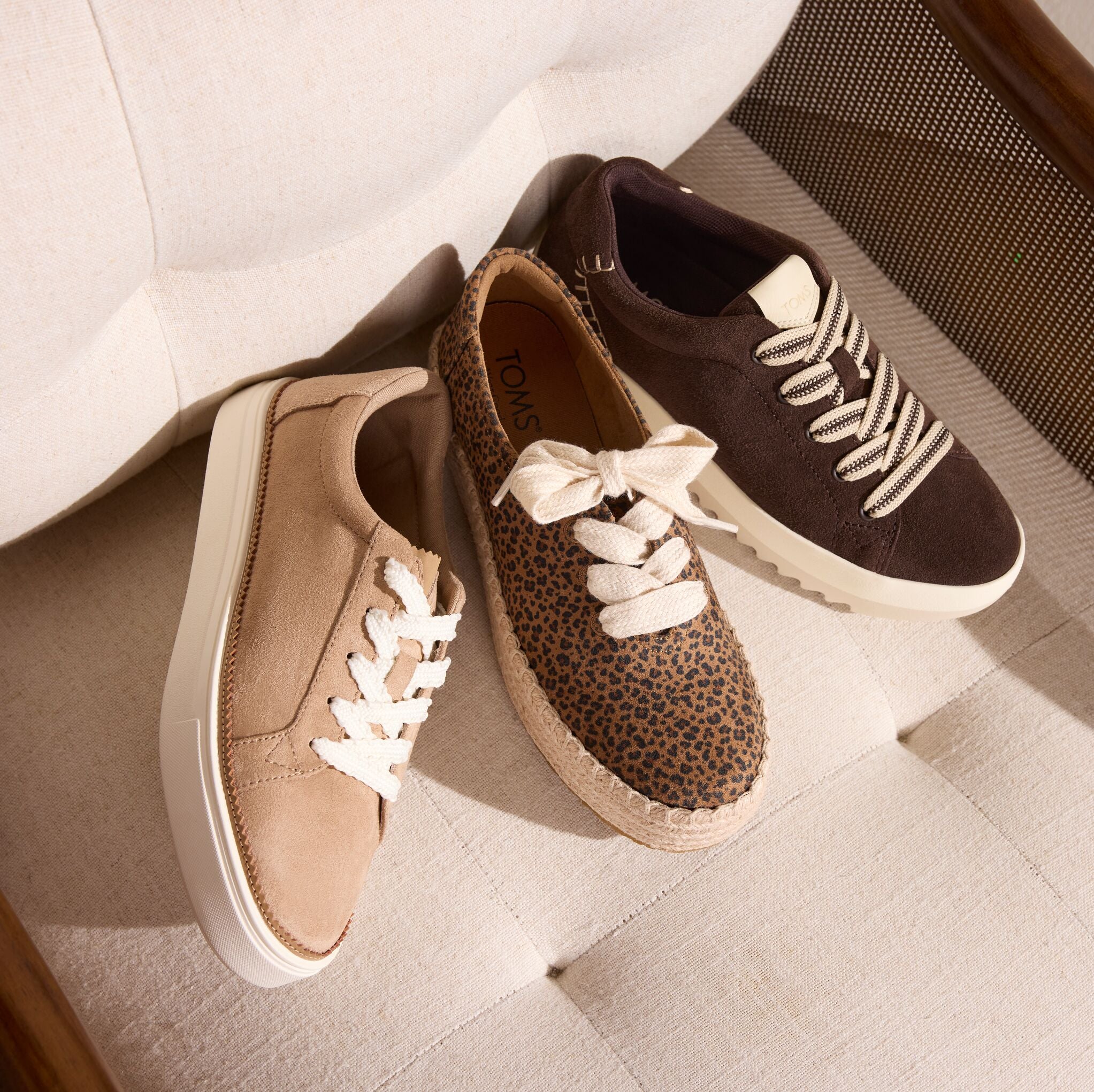 Laydown image of the Womens Izzy Lace-Up Sneaker  in Taupe, leopard lace up Valencia and chocolate suede Rea sneaker