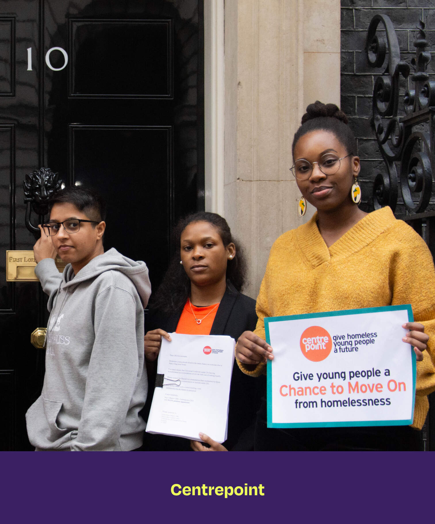 Centrepoint. Two young girls holding papers and a sign. The sign says "Give young people a Change to Move On from homelessness.