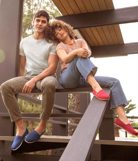 A man and woman wearing classic TOMS alpargatas.
