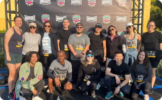TOMS and partner, Homeboy Industries, posing for a group photo at a 5K race.