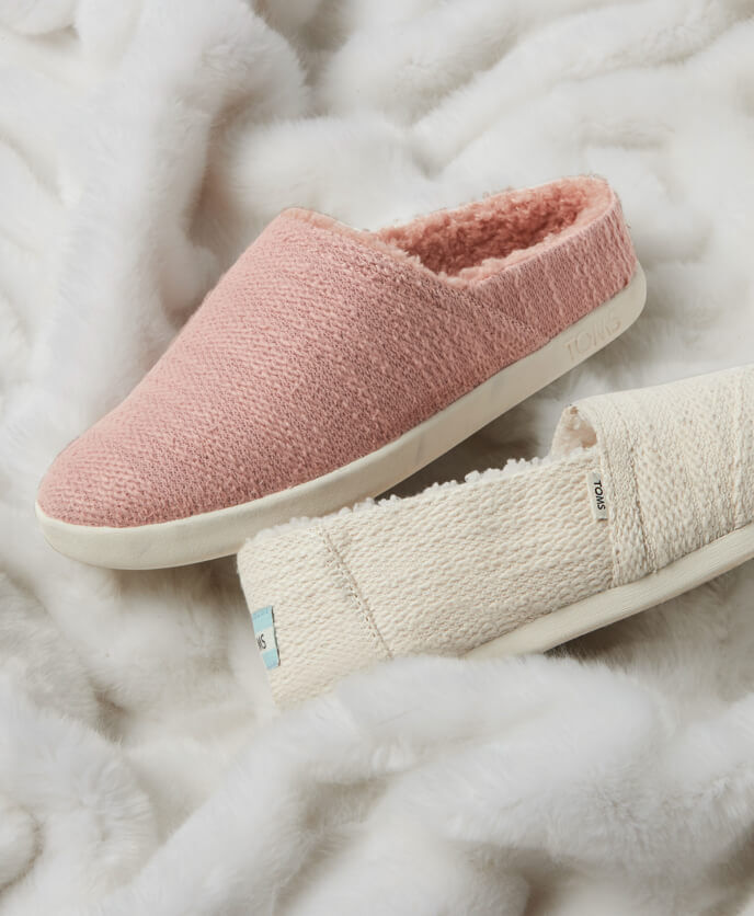 The TOMS x West Elm Alpargata Boucle in white and the TOMS x West Elm Alpargata Waffle Knit in grey shown.