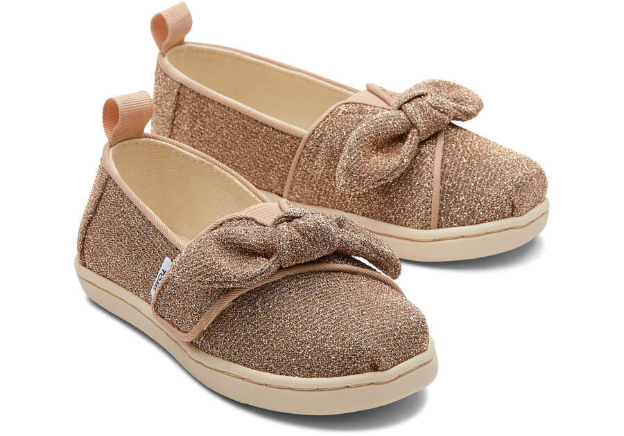 Tiny Alpargata Gold Sparkle Bow Toddler Shoe Front View Opens in a modal