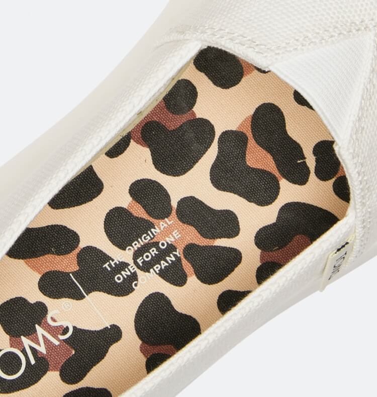 Close up of white style with leopard print insole.
