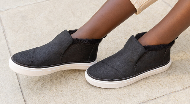 Women's Sneakers. Paxton Slip On in black leather lizard shown.